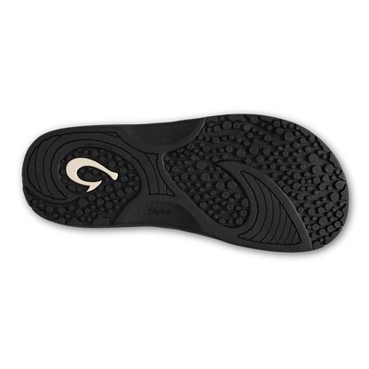 Black slide sandal sole with textured grip pattern and white curved logo detail.