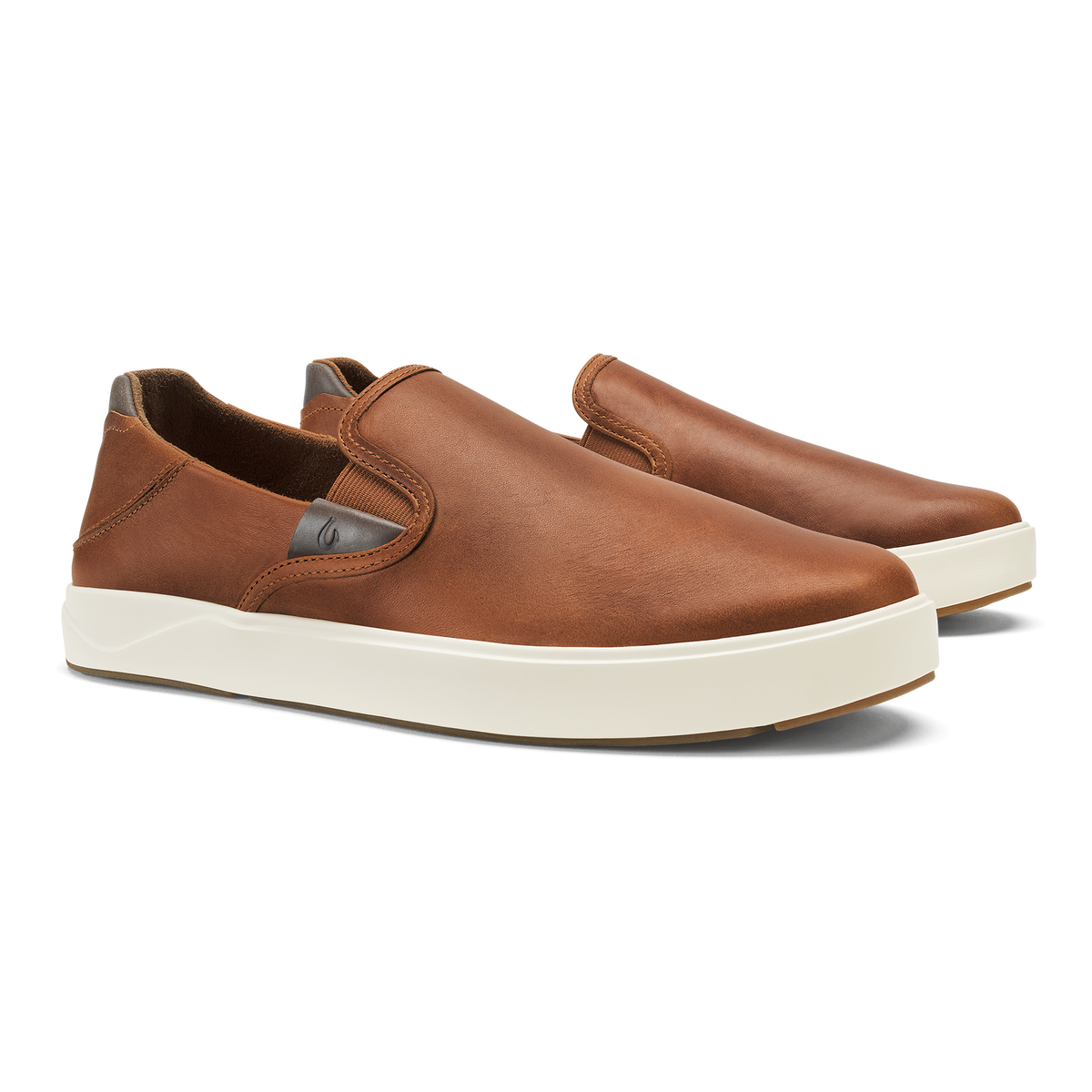 Tan leather slip-on sneaker with cream-colored rubber sole and dark heel tab.