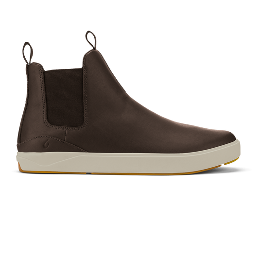 Dark brown leather Chelsea boot with cream and tan sole, elastic side panels, and pull tab.