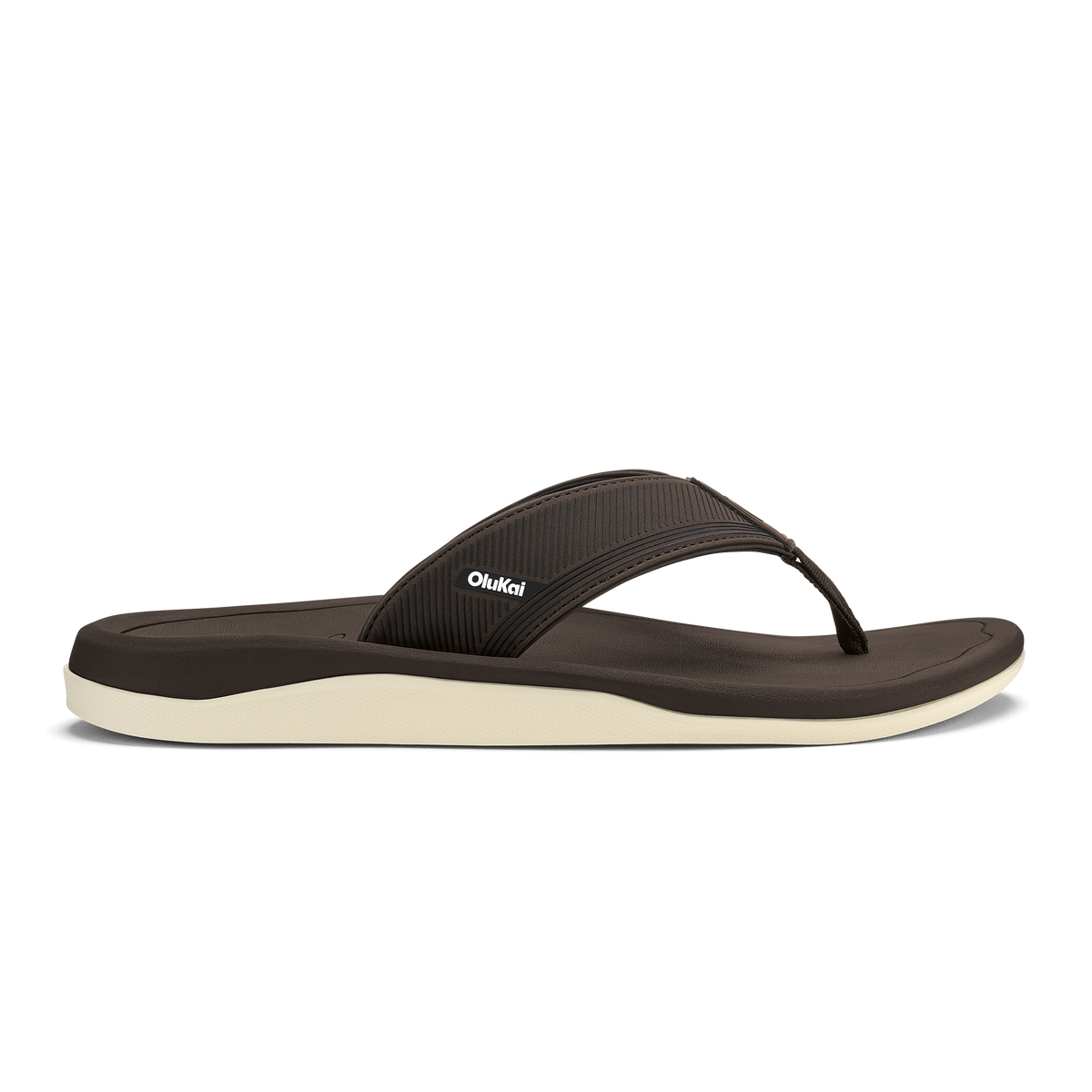 Dark brown thong sandal with cream-colored sole and textured upper strap.