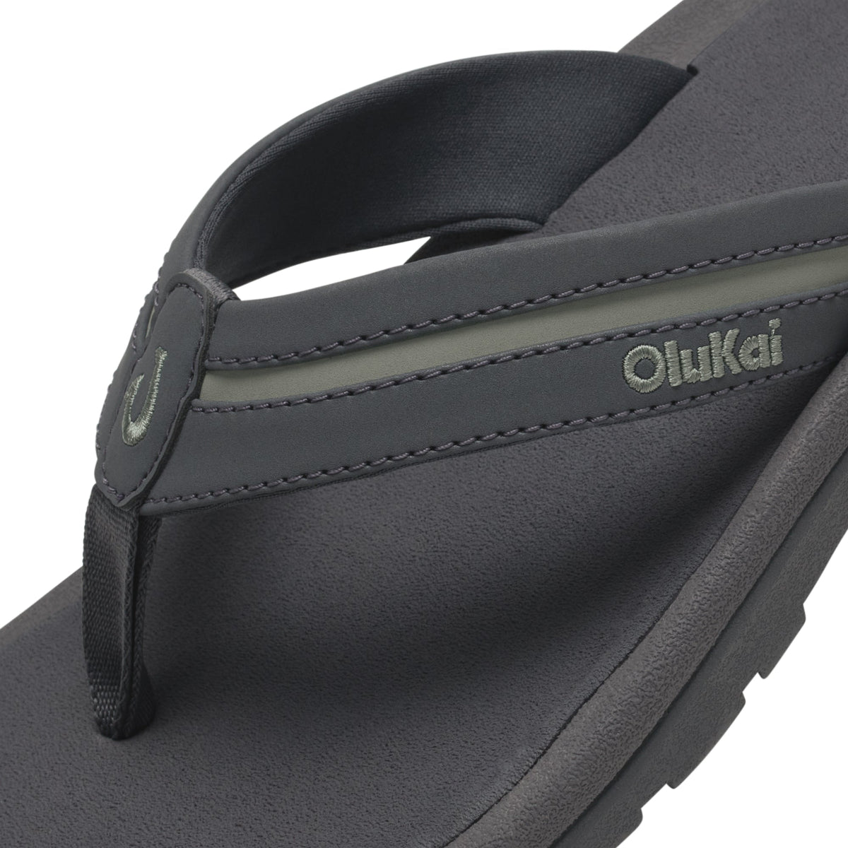 Grey and seagreen thong sandal with contoured footbed and branded strap detail.