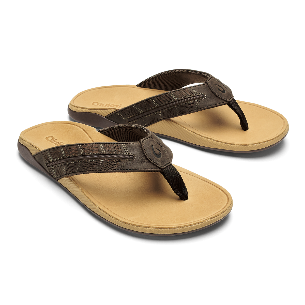 Pair of dark brown and tan thong sandals with padded footbeds and toe post straps.