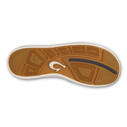Tan and white slip-on shoe sole with textured tread pattern, white logo, and blue accent stripe.