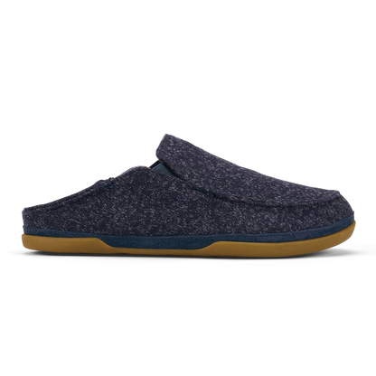 Dark blue knit slipper with tan rubber sole and navy trim, shown in profile view.