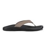 Warm taupe and black thong sandal with curved black sole and stitched toe strap.