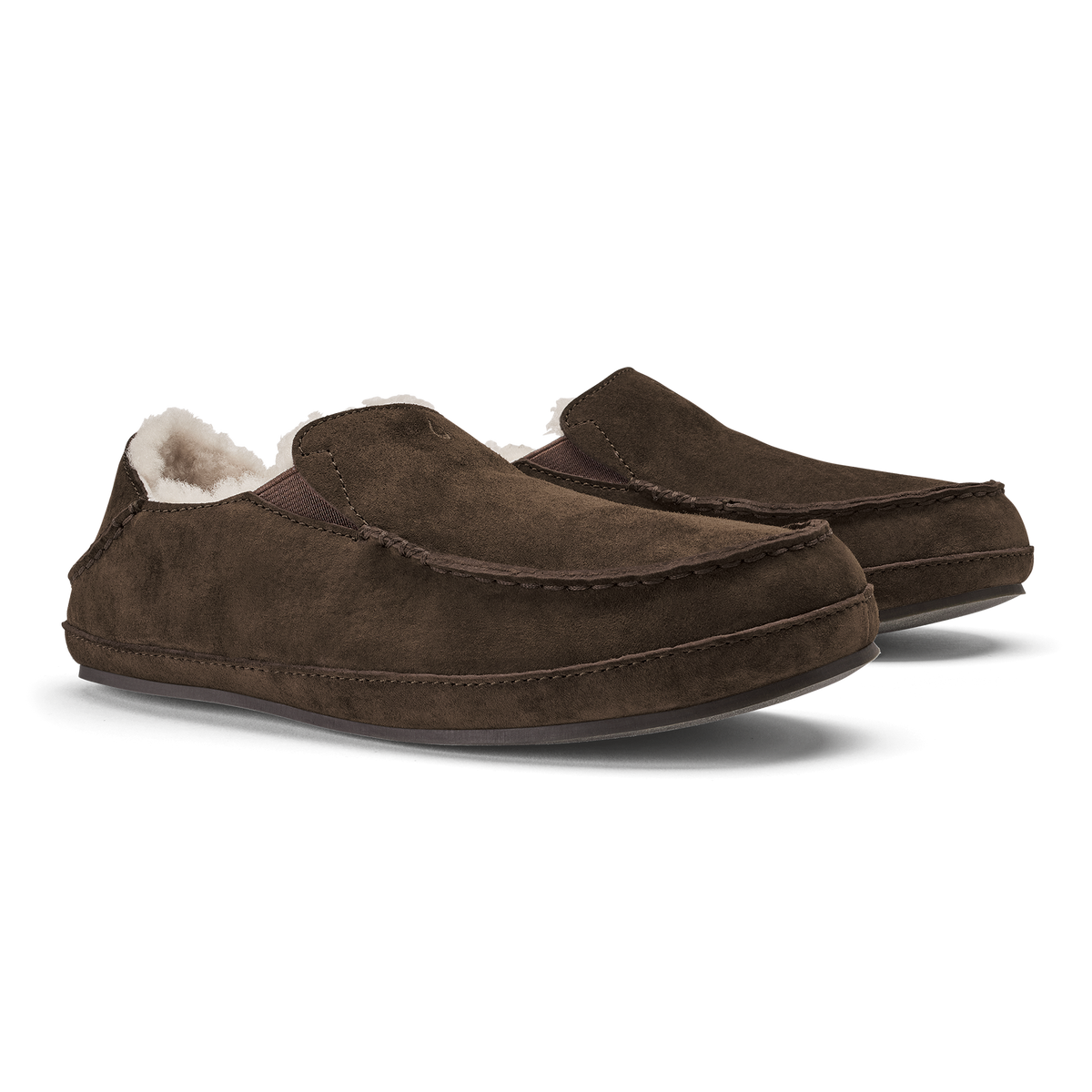 Dark oak suede slippers with white fleece lining and slip-on loafer design.