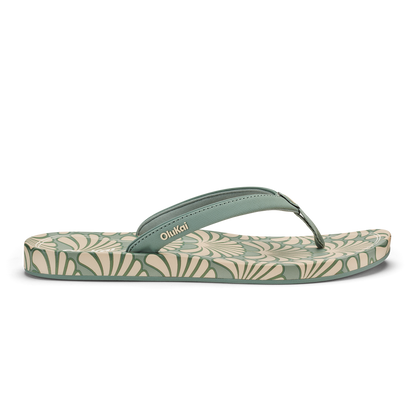 Silver and cream flip-flop with patterned footbed and solid thong strap, branded "OhiKai" on strap.