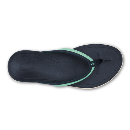 Dark blue flip-flop with mint green accent strap across the top, shown from above.