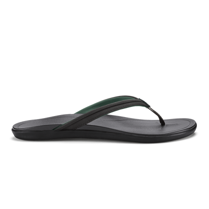 Black and dark green flip-flop sandal with textured footbed and thong strap, shown in side profile.