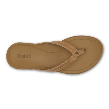Tan thong sandal with curved footbed and thin strap across the top, viewed from above.