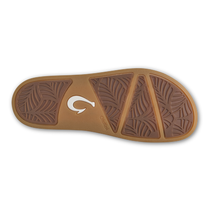 Tan sandal sole with leaf-pattern tread sections and white logo detail on center strap.